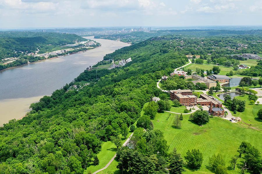 Louisville, KY - Aerial View of the Ohio Valley River Displaying Many Trees and Some Buildings on a Sunny Day